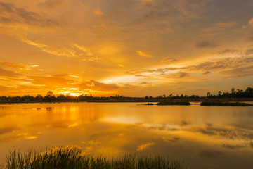 Fototapeta na wymiar Golden Sunset at the lake view