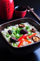 ramen noodles with shiitake mushrooms, green peas, sweet pepper and coriander