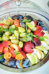 Beautifully decorated catering banquet table with different fruits  
