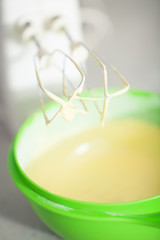 Tiramisu ingredients concept. Mixed egg yolks with sugar