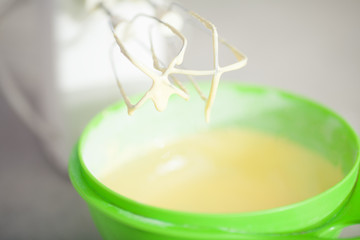 Tiramisu ingredients concept. Mixed egg yolks with sugar