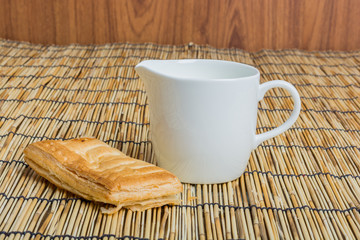 Breakfast pitcher of milk and bread