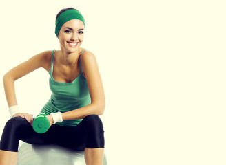 Young woman with fitness ball, with copyspace