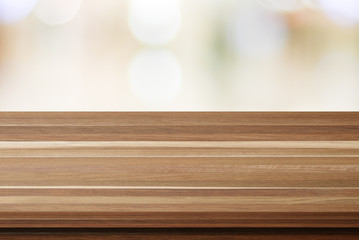 Empty table and blurred store with bokeh background
