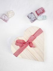 turkish delight with a  heart shaped gift box tied with a red an