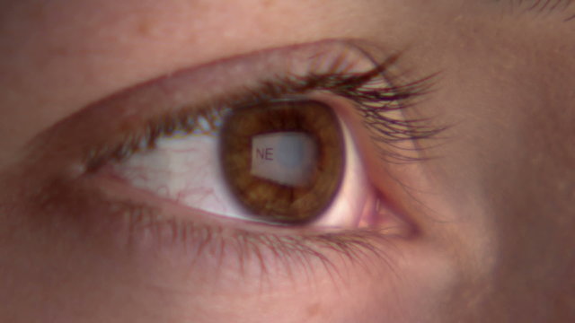 Eye watching the screen with reflection of the word "new life"