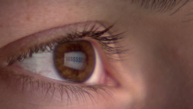 Eye watching the screen with reflection of symbol 