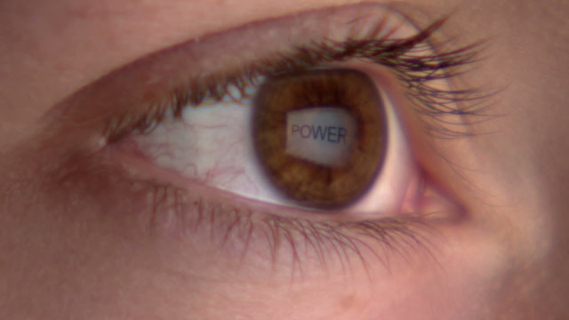 Eye watching the screen with reflection of the word 