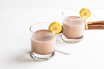 Glass of chocolate milkshake on the table