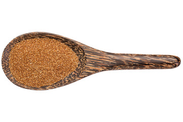 teff grain on wooden spoon