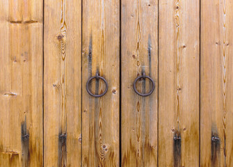 wooden gate.wooden door with wrought handles round