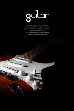 Electric guitar on dark background. Removable sample text.