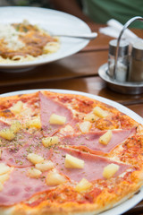 Tasty pizza with ham and cheese. Selective focus.