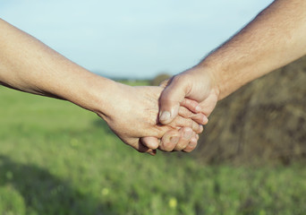 hands of an elderly couple outdoor