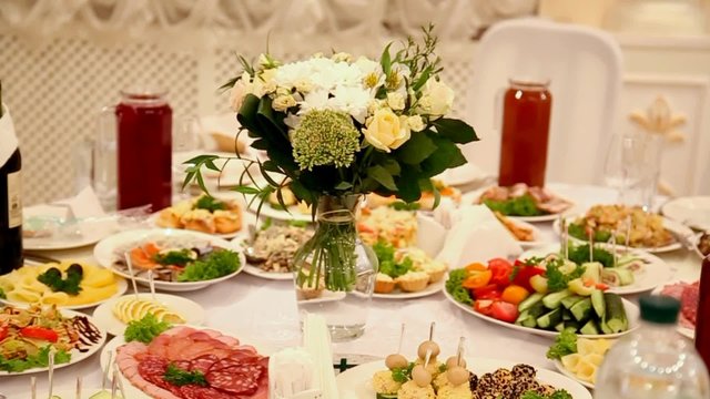 Floral decor on wedding tables in restaurant