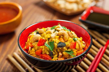 Fried rice with vegetables on table