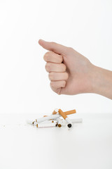 Hand crushing cigarettes