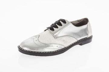 shoe made of grey leather with laces for women on white background