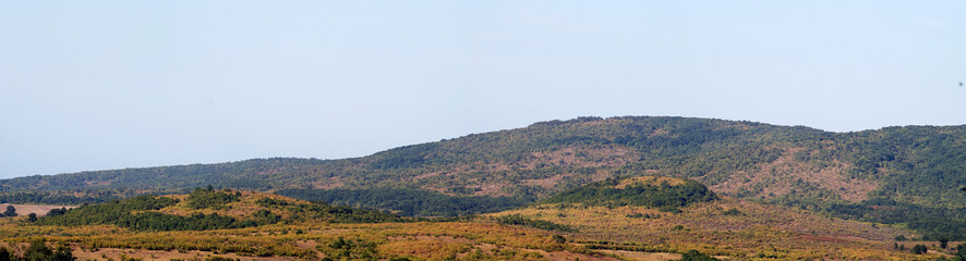 Fototapeta na wymiar Wide panorama of mountainous terrain