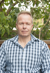 Portrait of attractive man in the garden