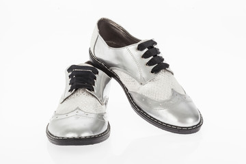 shoe made of grey leather with laces for women on white background