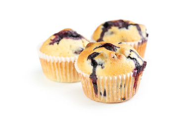 Tasty blueberry muffins isolated on a white