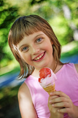 little girl with ice cream in the park