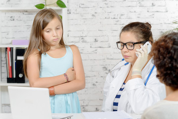 a little girl and her mother to the doctor, doctor phone