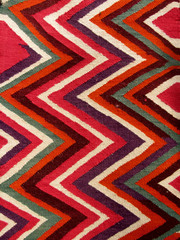 Close up of a hanged colourful handmade traditional wool rug - 90009195