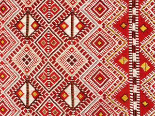Close up of a hanged colourful handmade traditional wool rug - 90009742