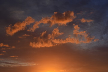 Naklejka na ściany i meble Island sunset, U.K. Lit low cloud at sunset.
