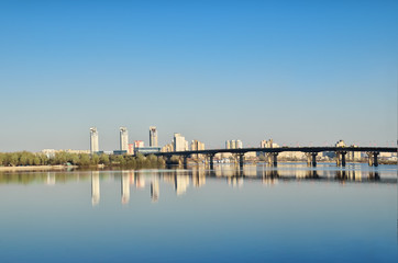 Bridge across the river against the background of the city