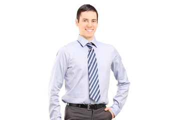 Young confident businessman posing