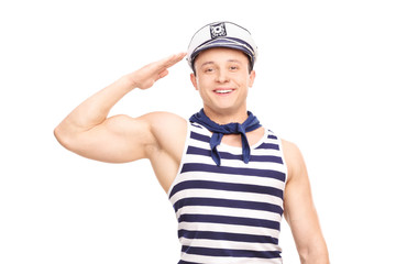 Young male sailor saluting towards the camera