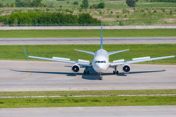 Fototapeta na wymiar Airplane ready to take off from runway. A big passenger or cargo