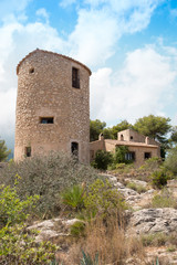 Fototapeta na wymiar Windmill and House in Javea, Spain