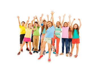 Fototapeta premium Many happy kids cheer and rise hands