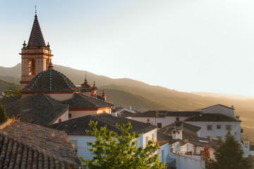 SPAIN, ANDALUSIA ZAHARA: View on old church during sunset in bea