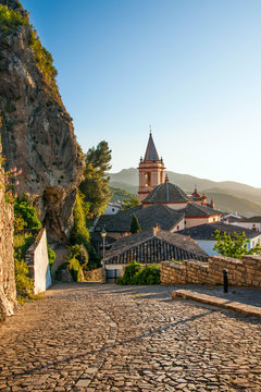 SPAIN, ANDALUSIA ZAHARA: View on old church during sunset in bea
