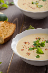 Creamy zucchini soup with chilli and oregano