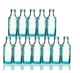 Stack of blue bottles back lit