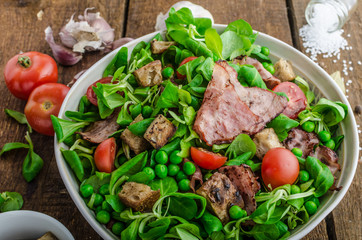 Fresh salad with bacon and croutons