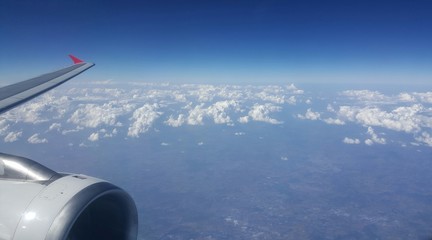 Airplane wing up in the sky