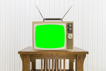 Old Television with Antenna on Wood Table with Chroma Screen