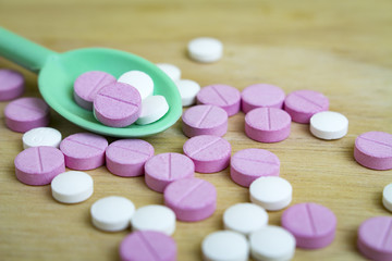 group of drugs on a spoon and wooden board