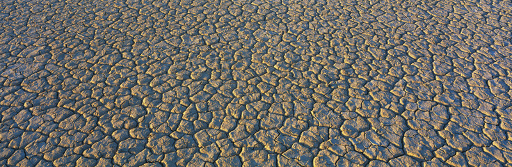 This is a dry lake bed at Cuddeback Dry Lake. It shows a pattern from the dried mud.