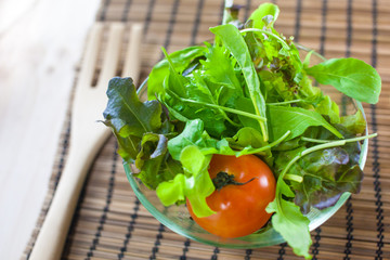 Fresh vegetable salad with green oak and tomato being prepared before cooking. (Shallow aperture intended for  the aesthetic quality of the blur.)