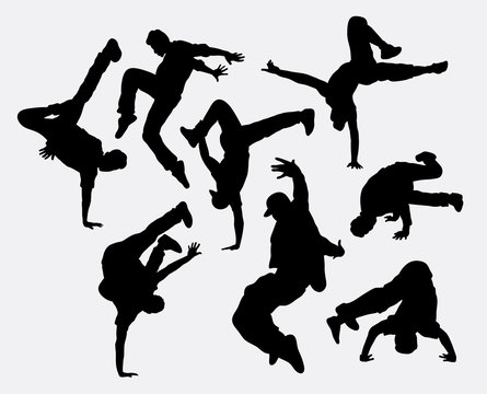People breakdance silhouettes