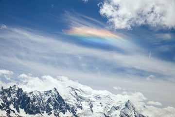 Obraz premium The rainbow on cloud in mountains