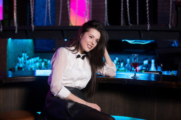 Beautiful girl sitting in bar